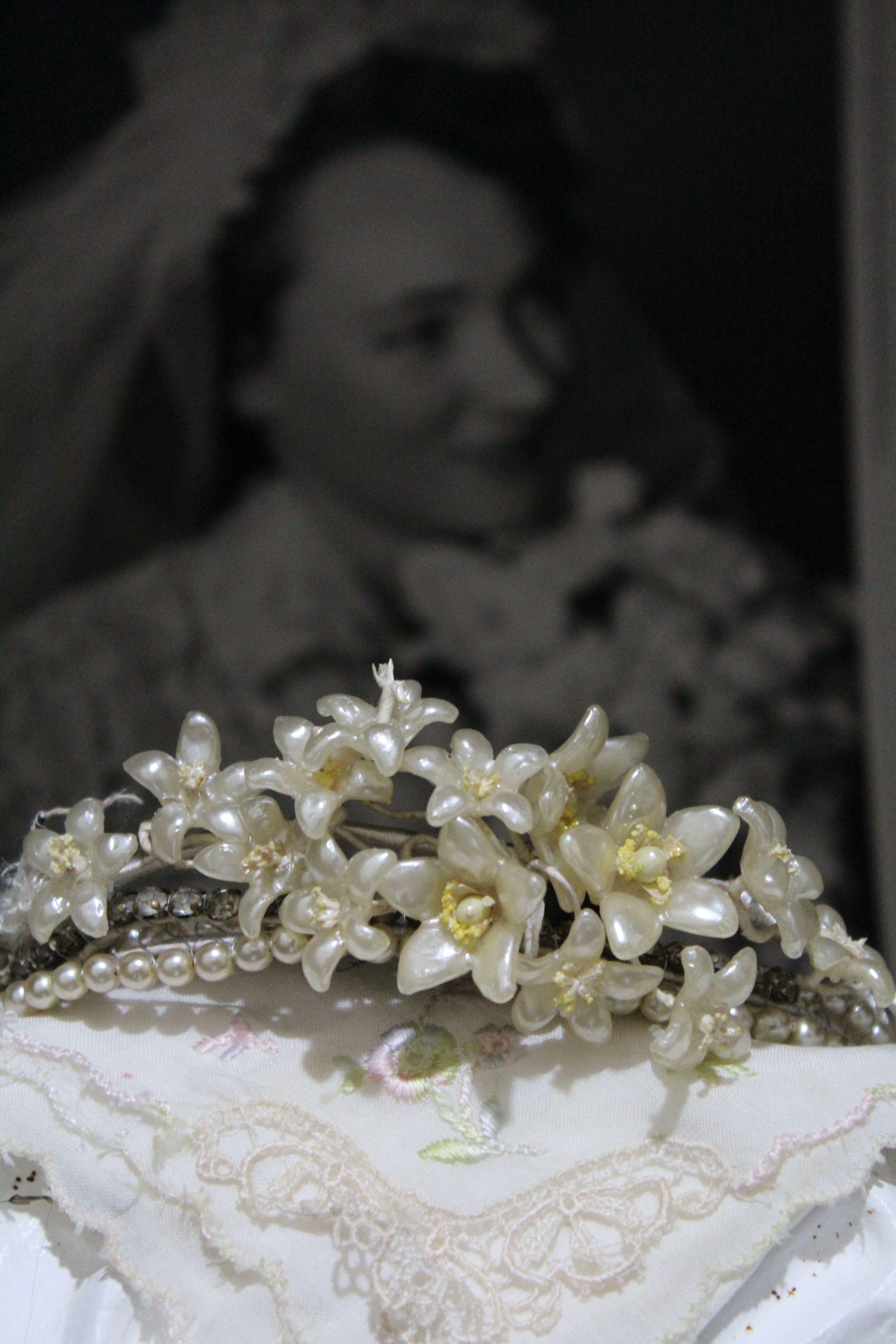 Lizzia’s tiara from her wedding day; her wedding handkerchief in the foreground. See Lizzia’s picture in the background. Credit: Malinda van Zyl.